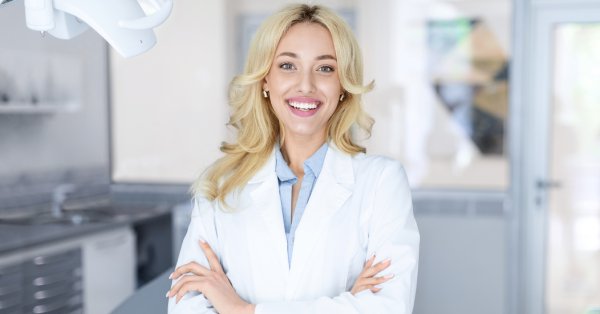 Smiling dentist in a modern dental office, representing a trusted dentist near you in Garland for complete family care